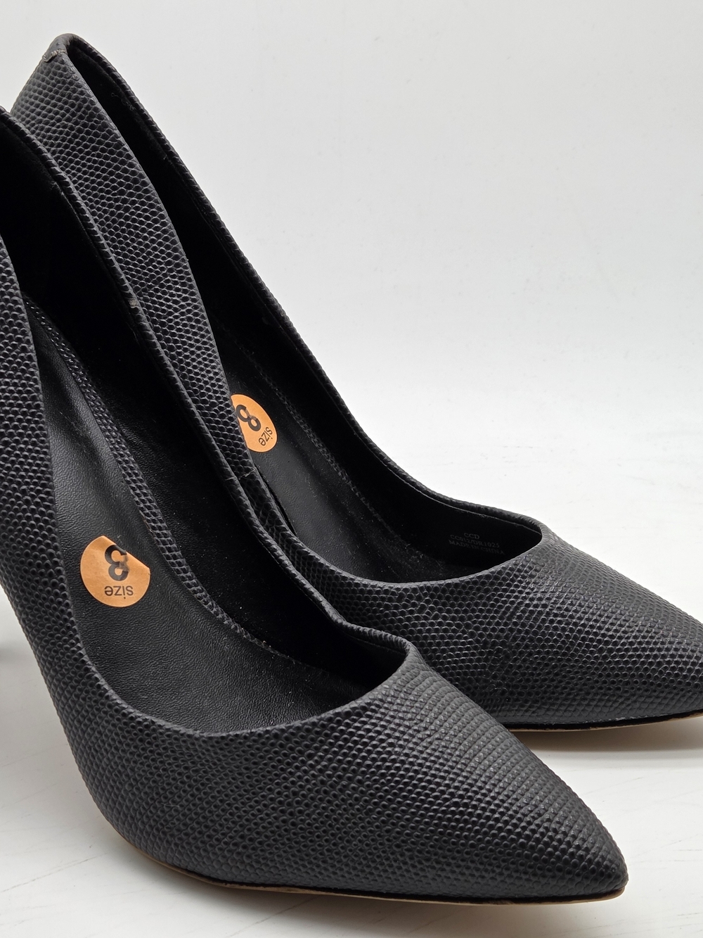 Charles by Charles David dark gray pumps featuring a textured embo